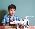 boy play toy with remote control dragon Royalty Free Stock Photo