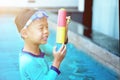 Boy play water gun with goggles in hotel vacation concept Royalty Free Stock Photo