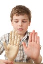 Boy is played by wooden hand of manikin