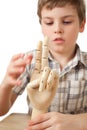 Boy is played by wooden hand of manikin isolated