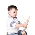 Boy is played by wooden little manikin Royalty Free Stock Photo