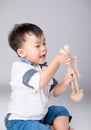 Boy is played by wooden little manikin Royalty Free Stock Photo