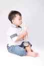 Boy is played by wooden little manikin isolated Royalty Free Stock Photo