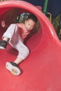 Boy sliding on playground Royalty Free Stock Photo