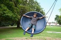 boy in playground swing