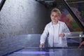 Boy playing on air hockey table Royalty Free Stock Photo
