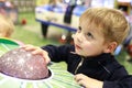 Boy playing arcade game Royalty Free Stock Photo