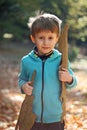 A boy playing in autumn