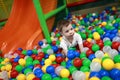 Boy playing in ball pool Royalty Free Stock Photo