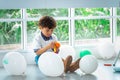 Boy playing balloons in birthday party Royalty Free Stock Photo