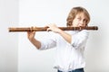 Boy playing bamboo flute Royalty Free Stock Photo