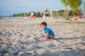 Boy playing on beach. Child play at sea on summer family vacation. Sand and water toys, sun protection for young child. Little boy Royalty Free Stock Photo