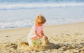 Boy playing on the beach on summer holidays. Children building a sandcastle at sea. Royalty Free Stock Photo