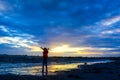 Boy playing on the beach at sunset Royalty Free Stock Photo