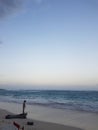 Boy playing on the beach at sunset Royalty Free Stock Photo