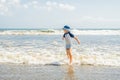 Boy playing on the beach in the water Royalty Free Stock Photo