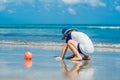 Boy playing on the beach in the water Royalty Free Stock Photo