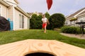 Boy playing bean bag toss in the backyard! Royalty Free Stock Photo