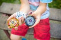 Boy playing with a beyblade spinning top outdoors