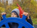 boy playing captain of ship in playground outdoor