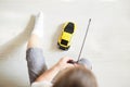 A boy playing with a car remote Royalty Free Stock Photo