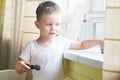 A boy playing with a car remote Royalty Free Stock Photo