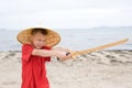 Boy playing with children's katana