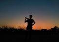 Boy playing cricket in India in the evening. Royalty Free Stock Photo