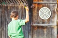 Boy playing darts outdoor Royalty Free Stock Photo