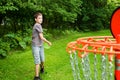 Boy playing disc golf