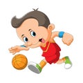 The boy is playing and dribbling the basket ball Royalty Free Stock Photo