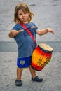 Boy playing drumms at street, calls parade carnival, montevideo, uruguay