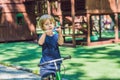 Boy playing with fidget spinner. Child spinning spinner on the p