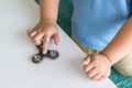 Boy playing fidget spinners