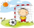 Boy playing football as a goalkeeper Royalty Free Stock Photo