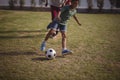 Boy playing football with his father and grandson Royalty Free Stock Photo