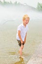 Boy playing in the fountain Royalty Free Stock Photo