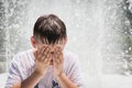 Boy Playing in Fountain Royalty Free Stock Photo