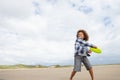 Boy playing frisbee on beach Royalty Free Stock Photo