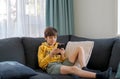 A boy playing game on smartphone