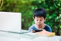 The boy playing game on smartphone Royalty Free Stock Photo