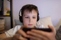 Boy playing game on smartphone Royalty Free Stock Photo