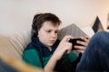 Boy playing game on smartphone Royalty Free Stock Photo