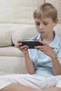 Boy Playing Games On PSP