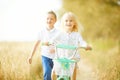 Boy playing with a girl in the autumn field Royalty Free Stock Photo