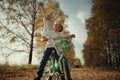 Boy playing with a girl in the autumn road Royalty Free Stock Photo