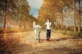 Boy playing with a girl in country road Royalty Free Stock Photo