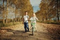 Boy playing with a girl in country road Royalty Free Stock Photo