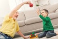 Boy playing with grandfather in building kit Royalty Free Stock Photo