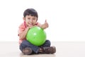 boy playing green ball Royalty Free Stock Photo